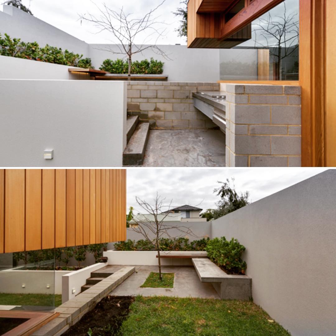 Magnolia Residence:  Outdoor Rooms - the natural fall of the site allowed us to create a secondary more private terrace to the rear of the home.  Integrated concrete bench seating, central tree planting, and the lower scale of the home provides a sense of intimacy...